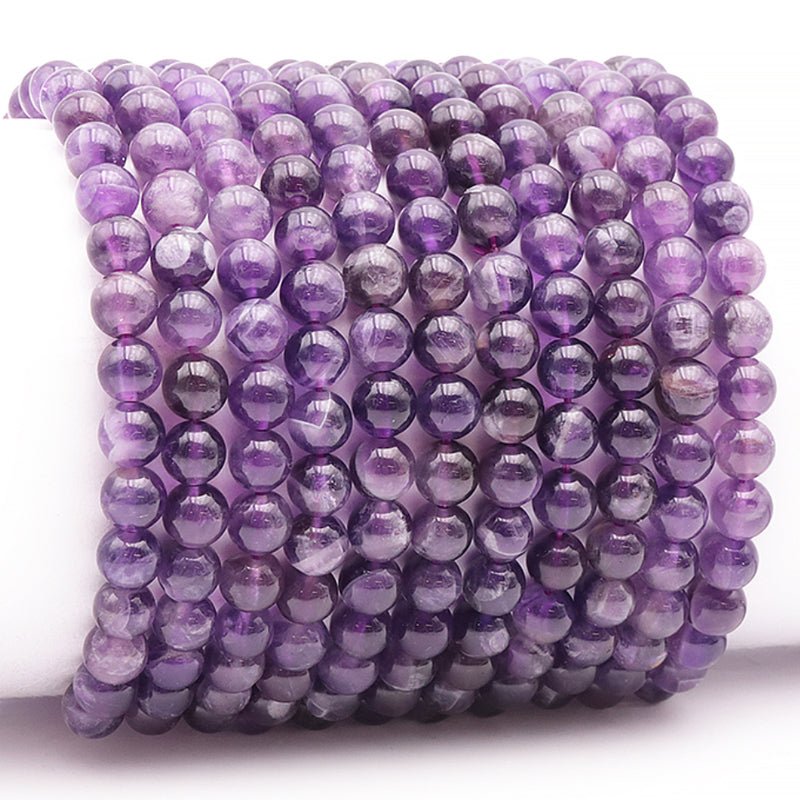 Bracelet améthyste rubanée Brésil AA (boules 5 - 6mm) - La Boite à Cailloux