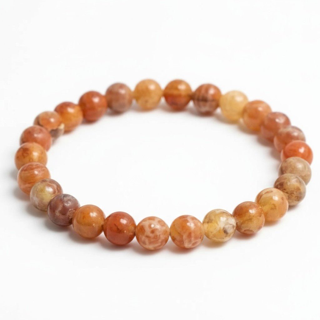 Bracelet agate de feu Brésil A (boules 5 - 6mm) - La Boite à Cailloux