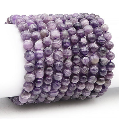 Bracelet améthyste rubanée Brésil AA (boules 7 - 8mm) - La Boite à Cailloux