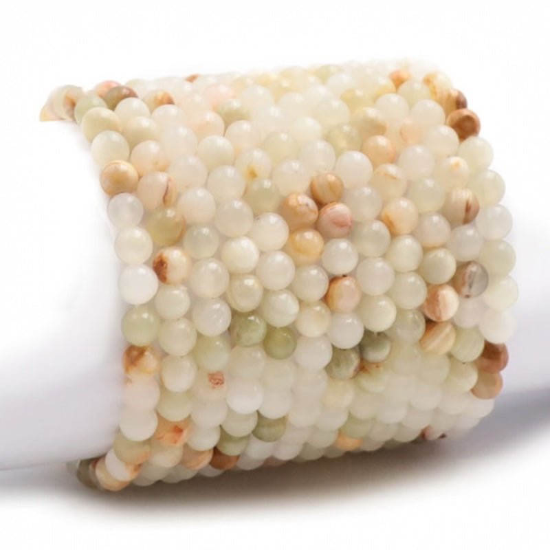 Bracelet aragonite Pérou A (boules 5 - 6mm) - La Boite à Cailloux