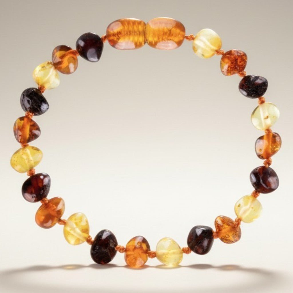 Bracelet bébé ambre 3 couleurs Lituanie AA (perles baroques) - La Boite à Cailloux
