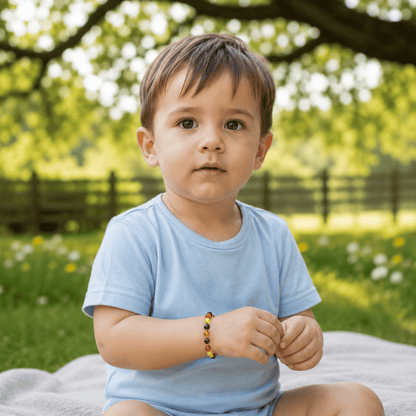 Bracelet bébé ambre multicolore Lituanie AA (perles baroques) - La Boite à Cailloux