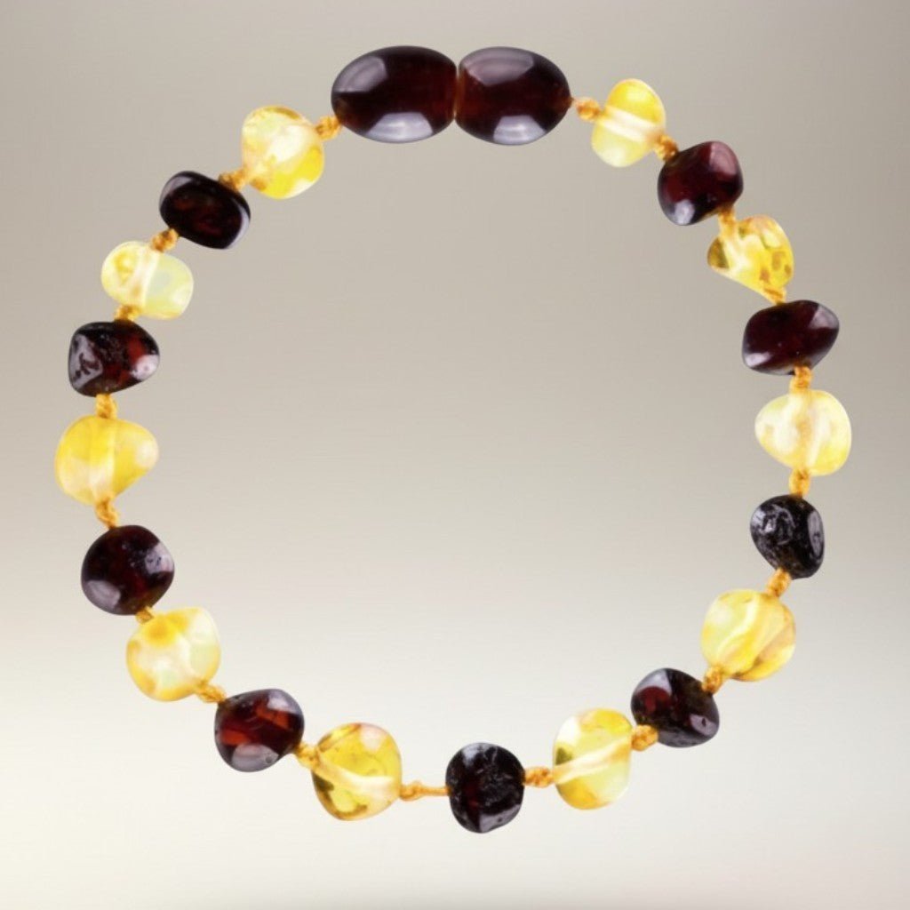 Bracelet bébé bicolore ambre cerise et ambre miel Lituanie AA (perles baroques) - La Boite à Cailloux