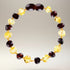 Bracelet bébé bicolore ambre cerise et ambre miel Lituanie AA (perles baroques) - La Boite à Cailloux