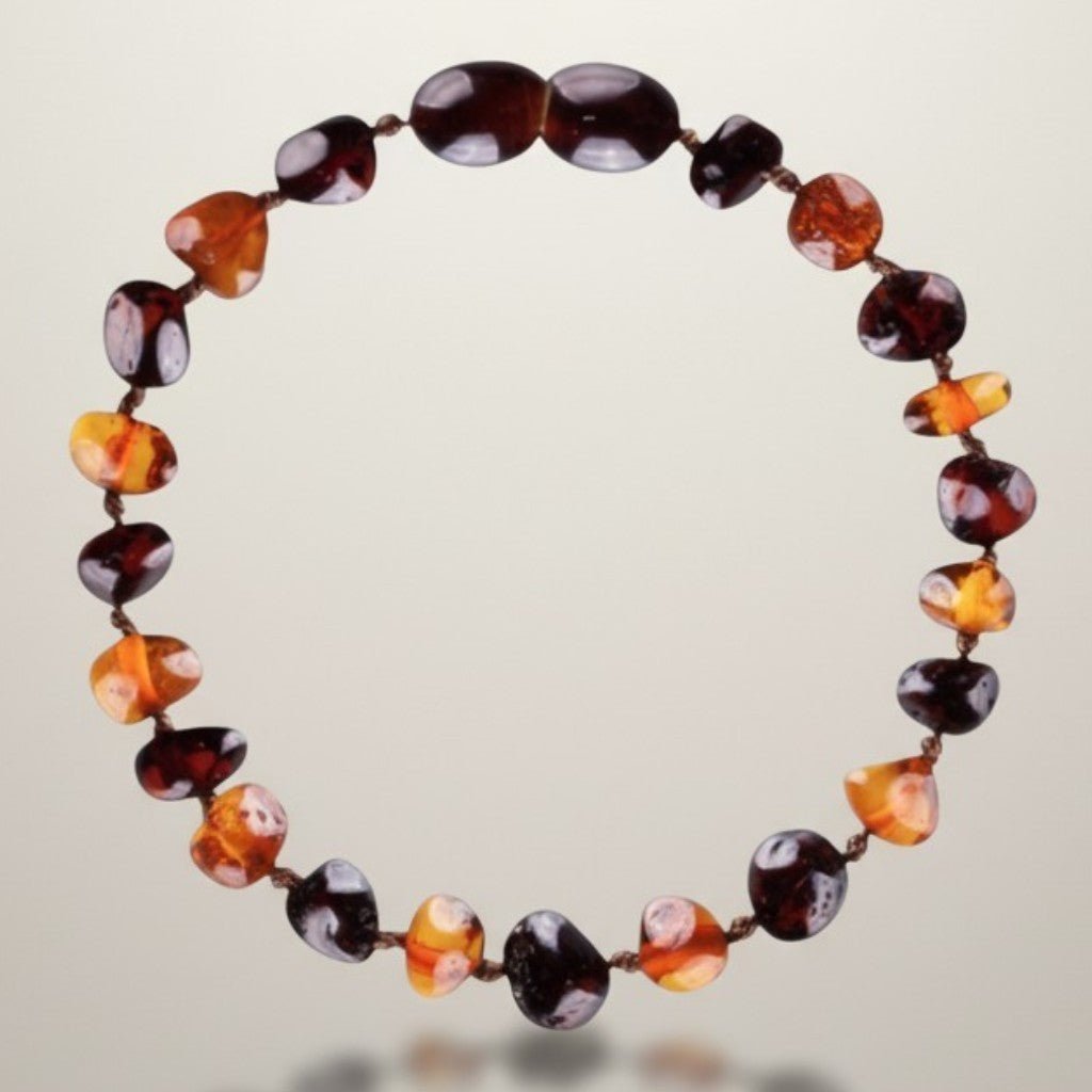 Bracelet bébé bicolore ambre cognac et ambre cerise Lituanie AA (perles baroques) - La Boite à Cailloux