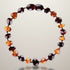 Bracelet bébé bicolore ambre cognac et ambre cerise Lituanie AA (perles baroques) - La Boite à Cailloux