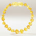 Bracelet bébé en ambre miel Lituanie AA (perles baroques) - La Boite à Cailloux