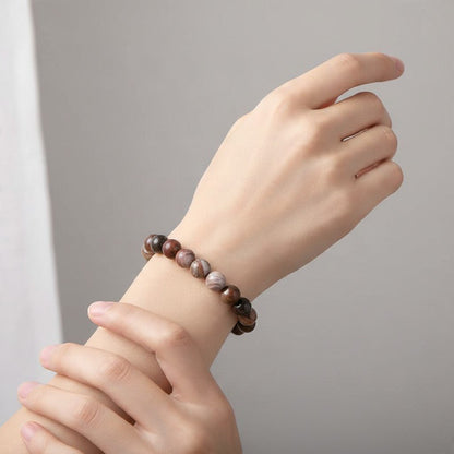 Bracelet bois fossilisé Etats-Unis A (boules 7-8mm) - La Boite à Cailloux