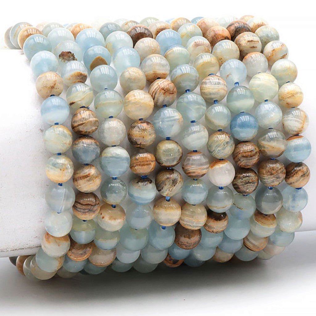Bracelet calcite bleue sur Guangue Mexique AA (boules 7,5-8,5mm) - La Boite à Cailloux