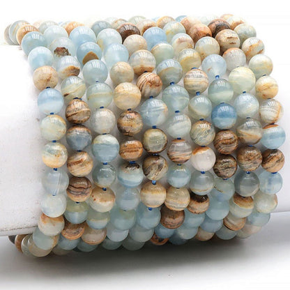 Bracelet calcite bleue sur Guangue Mexique AA (boules 7,5-8,5mm) - La Boite à Cailloux