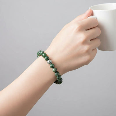 Bracelet diopside vert  Etats-Unis AB (boules 7-8mm)