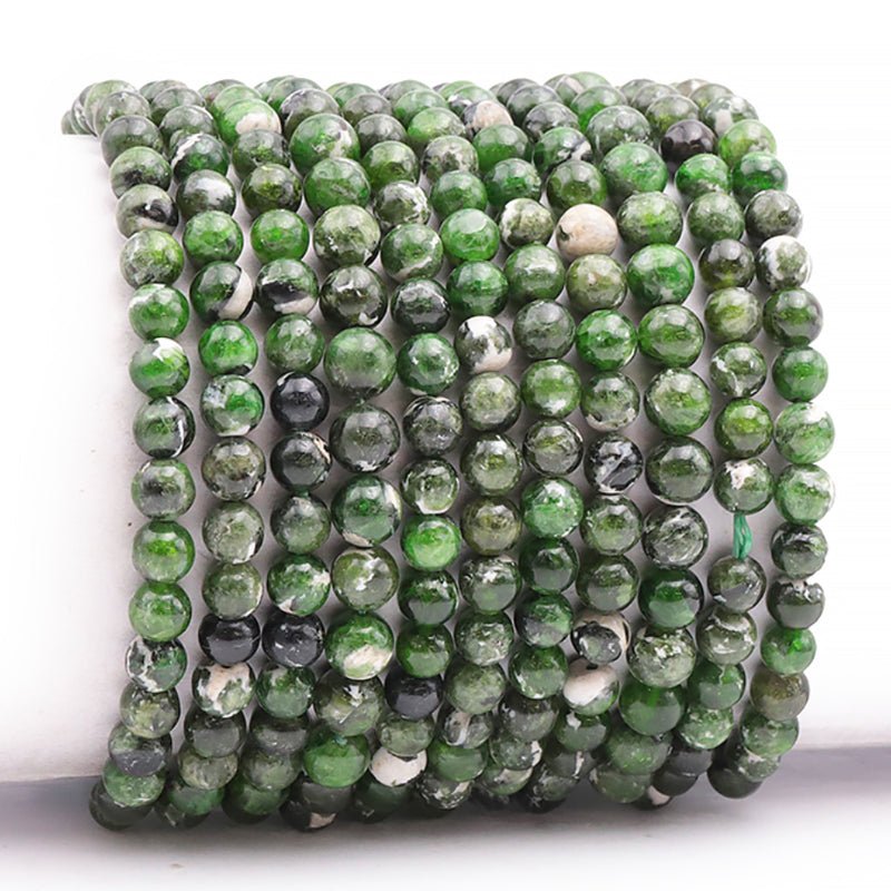 Bracelet diopside Vert sur gangue Etats - Unis AA (boules 5,5 - 6,5mm) - La Boite à Cailloux