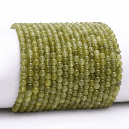 Bracelet grenat vert (grossulaire) Mali A+ (boules 3 - 4mm) - La Boite à Cailloux