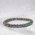 Bracelet Hématite arc en ciel Chine A (boules de 5-6mm) - La Boite à Cailloux
