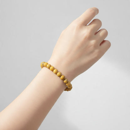 Bracelet jaspe Bumble Bee Indonésie AA (boules 6.5-7.5mm) - La Boite à Cailloux
