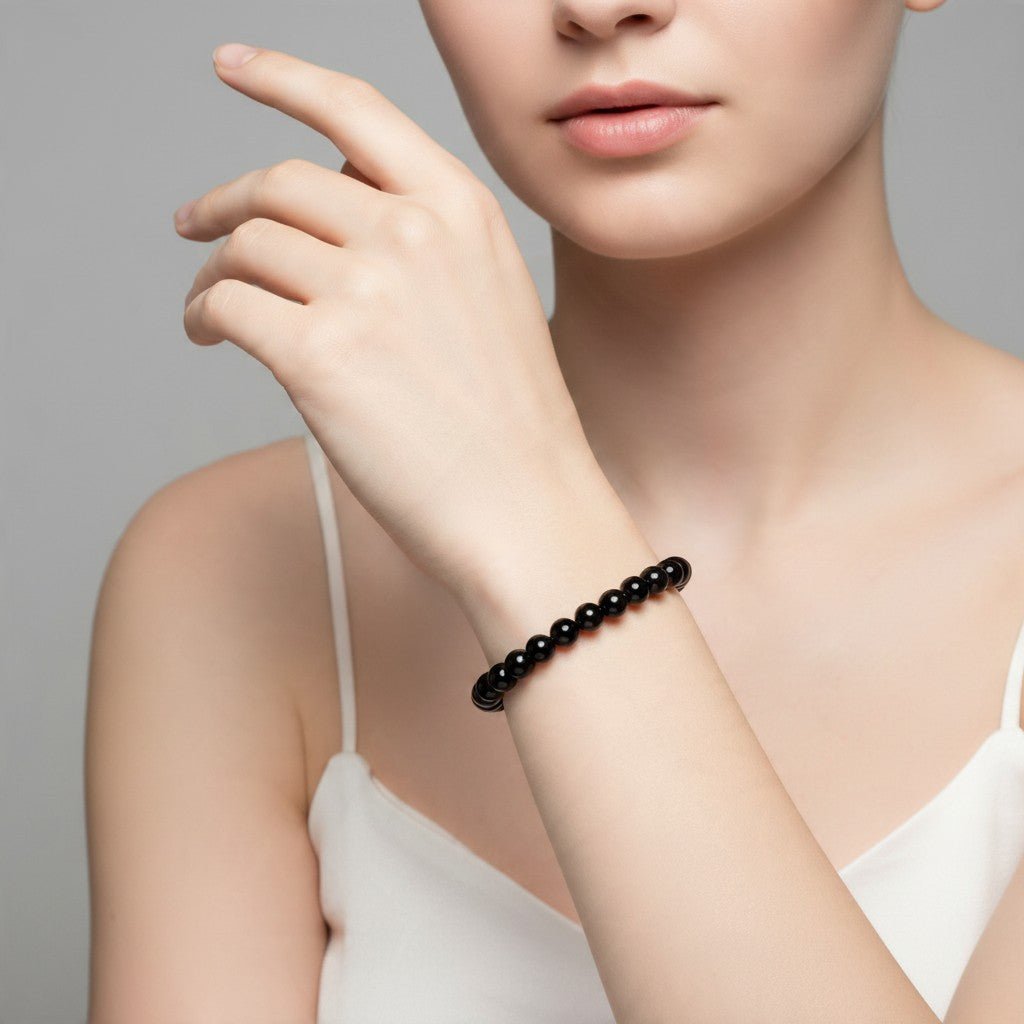 Bracelet onyx noir Brésil A (boules 5-6mm) - La Boite à Cailloux