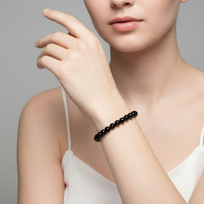 Bracelet onyx noir Brésil A (boules 5-6mm) - La Boite à Cailloux