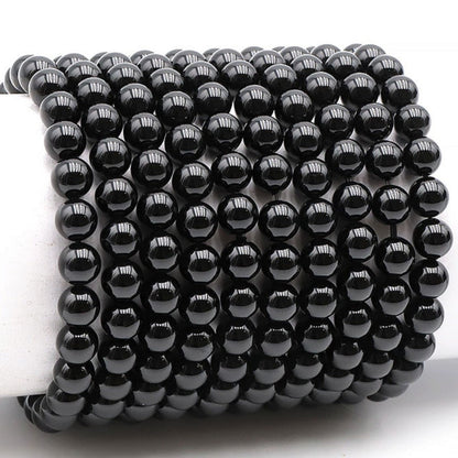 Bracelet onyx noir Brésil A (boules 7-8mm) - La Boite à Cailloux
