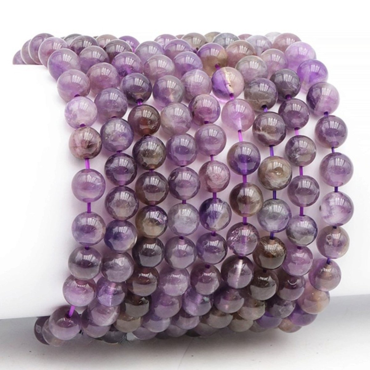 Bracelet taille enfants améthyste Brésil A (boules 7-8mm) - La Boite à Cailloux
