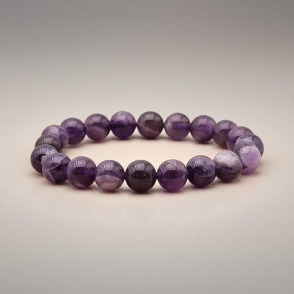Bracelet taille enfants améthyste rubanée Brésil A (boules 7 - 8mm) - La Boite à Cailloux