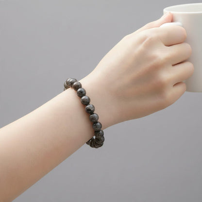 Bracelet yooperlite Russie A (boules 10mm) - La Boite à Cailloux