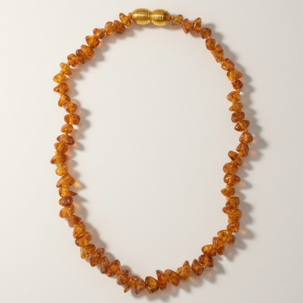 Collier bébé ambre cognac Lituanie AA (perles baroques) - La Boite à Cailloux