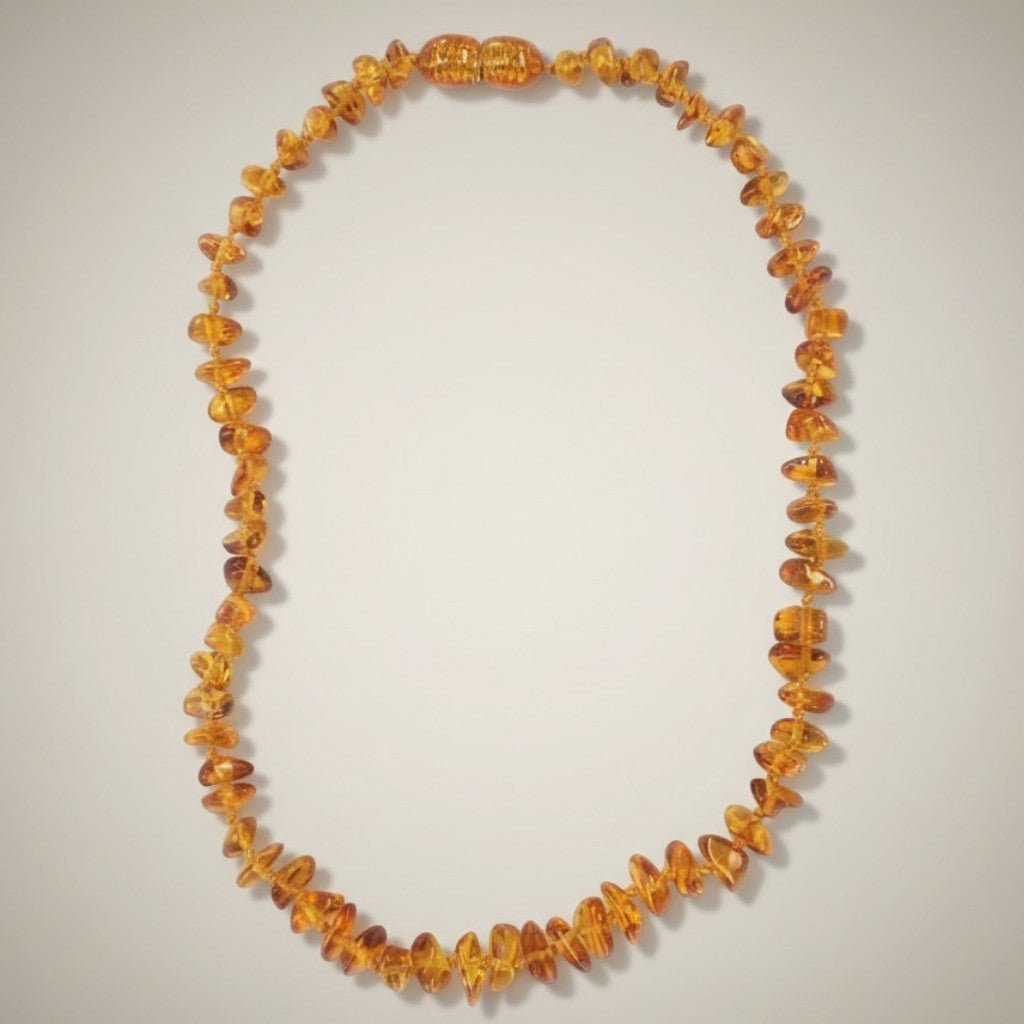 Collier bébé ambre miel Lituanie AA (perles baroques) - La Boite à Cailloux