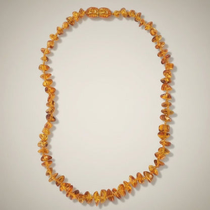 Collier bébé ambre miel Lituanie AA (perles baroques) - La Boite à Cailloux
