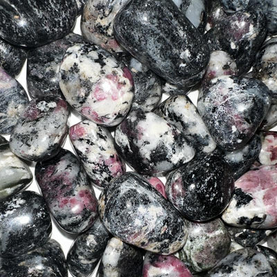 Eudialyte on syenite Russia A (rolled stone)