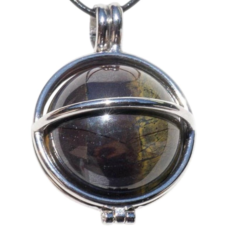 Pendentif boule oeil de fer Afrique du Sud A dans cage - La Boite à Cailloux