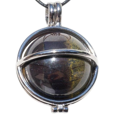 Pendentif boule oeil de fer Afrique du Sud A dans cage