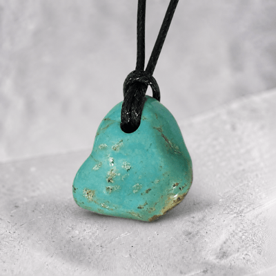 Tibet A stabilized turquoise pendant (holey stone) + cord
